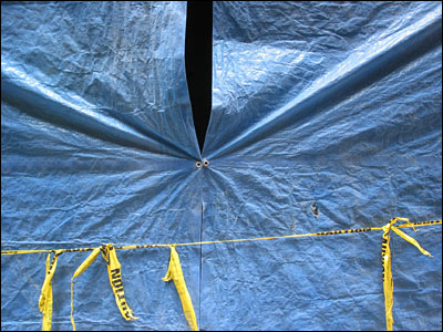 Blue tarpaulin and caution tape. 4th Avenue Southwest, Calgary. 25 July 2002. Copyright © 2002 Grant Hutchinson