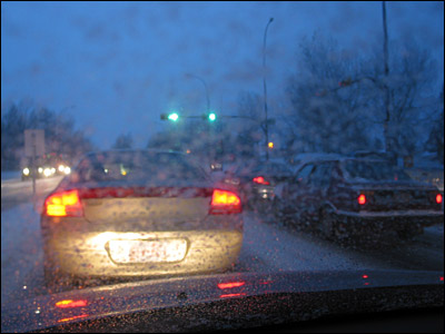 Rush hour traffic in the snow. Canyon Meadows Drive, Calgary. 28 October 2002. Copyright © 2002 Grant Hutchinson