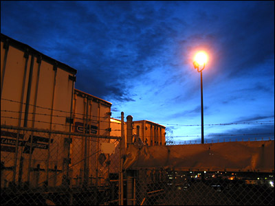 Semi trailer storage lot at dusk. Highfield Road, Calgary. 08 November 2004. Copyright © 2004 Grant Hutchinson