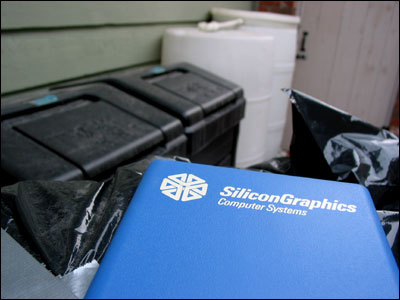 Silicon Graphics salvage next to compost bins and water barrels. Calgary. 11 April 2002. Copyright © 2002 Grant Hutchinson