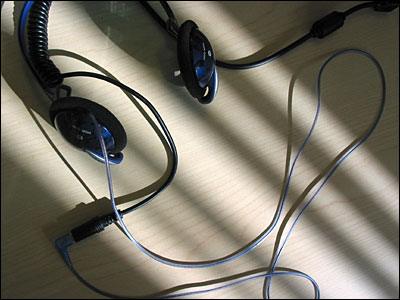 Headphones on desk in the late afternoon. Calgary. 19 April 2002. Copyright © 2002 Grant Hutchinson