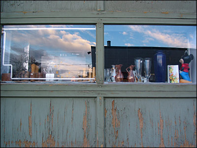 Ephemera in window of antique shop. 9th Avenue and 14th Street Southeast, Calgary. 07 November 2002. Copyright © 2002 Grant Hutchinson
