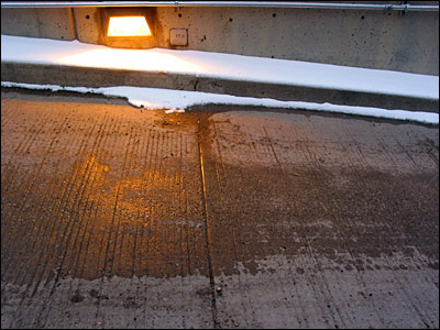 Parkade ramp with sodium vapor sconce. 5th Avenue Southwest, Calgary. 06 March 2003. Copyright © 2003 Grant Hutchinson